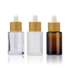주문 로고 100ml 무광택 유리 화장품 포장 15ml 20ml 30ml 50ml 대나무 점적기 모자를 가진 둥근 유리제 머리 얼굴 정유 병